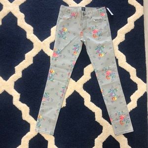 Grey jeans with bright floral details